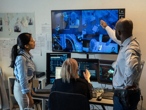 Security professionals analyze live feeds during video verification, ensuring accurate responses with GCCTVMS.