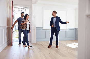 real estate agent showing house