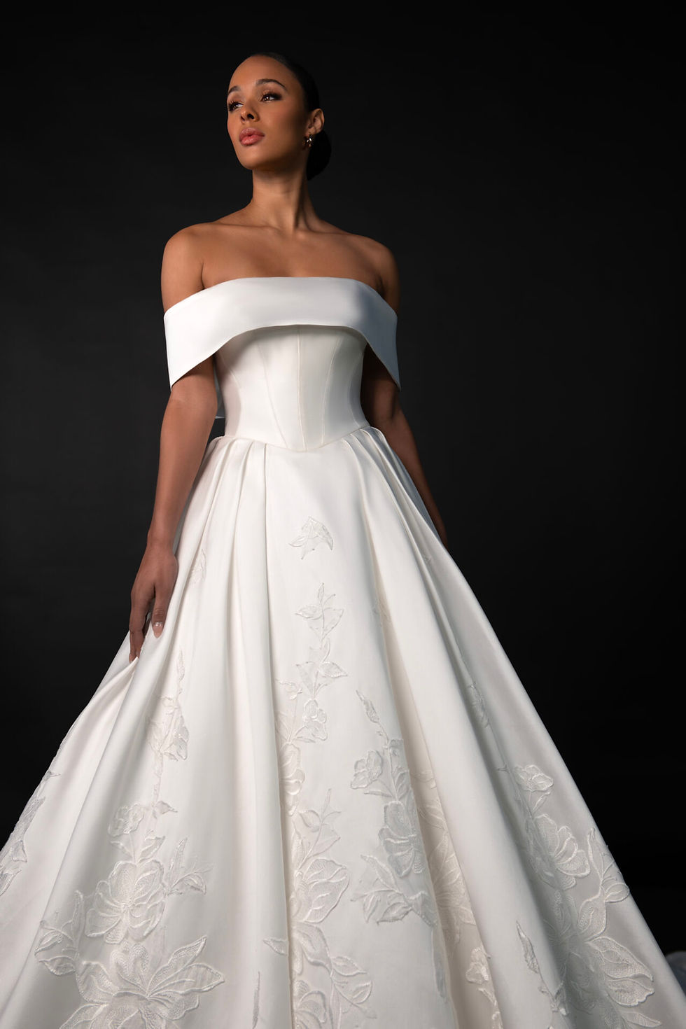 Bride wearing Martina Liana 1897 off-the-shoulder satin ballgown wedding dress with structured corset bodice, full embroidery