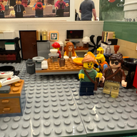 LEGO mini figures on a LEGO model of an archaeological laboratory