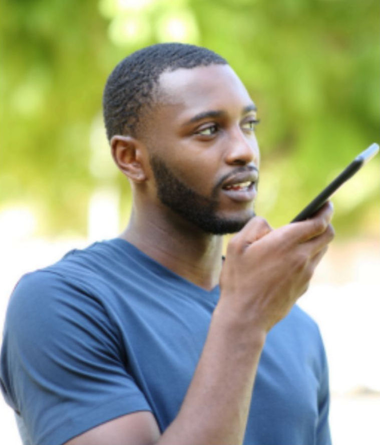 Person speaking into a mobile phone