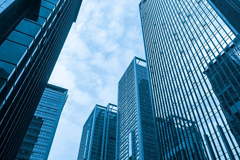 Looking Up Blue Modern Office Building.jpg