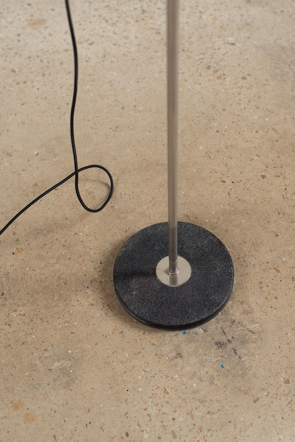 Thumbnail: A tubular chrome floor lamp on a solid metal base, C1950/60