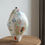 Thumbnail: A stoneware sculptural vessel with glaze and stains by artist Linda Lencovic.