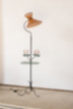 A unique French pierced metal floor lamp with metalwork flowers and a drinks table, C1950.