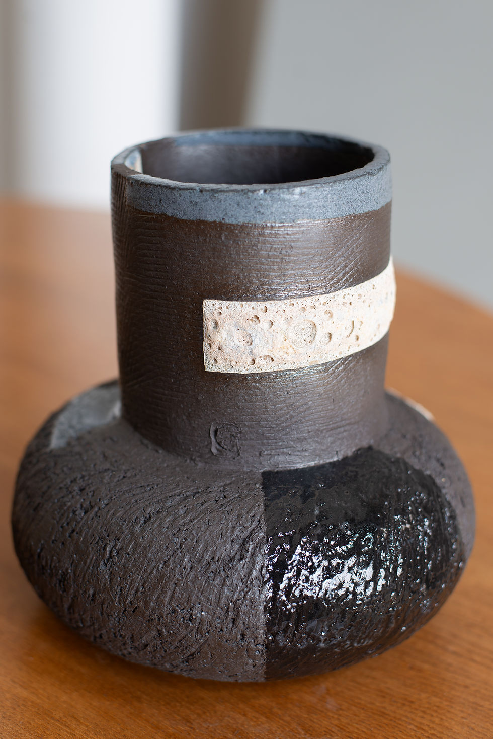 Thumbnail: Black terracotta sculptural vessel with slip, glaze and volcanic glaze from St Leonard’s ceramicist Eddie Knevett.