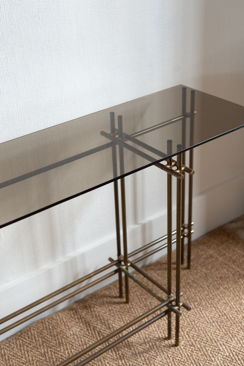 A Willy Rizzo and Romeo Rega brass tubular console table with smoked glass top. Circa 1970’s