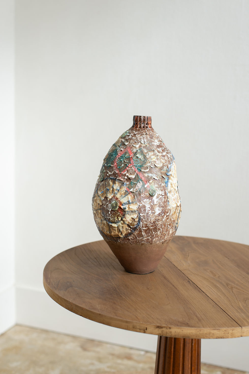 A stoneware sculptural vessel with glaze and stains by artist Linda Lencovic.