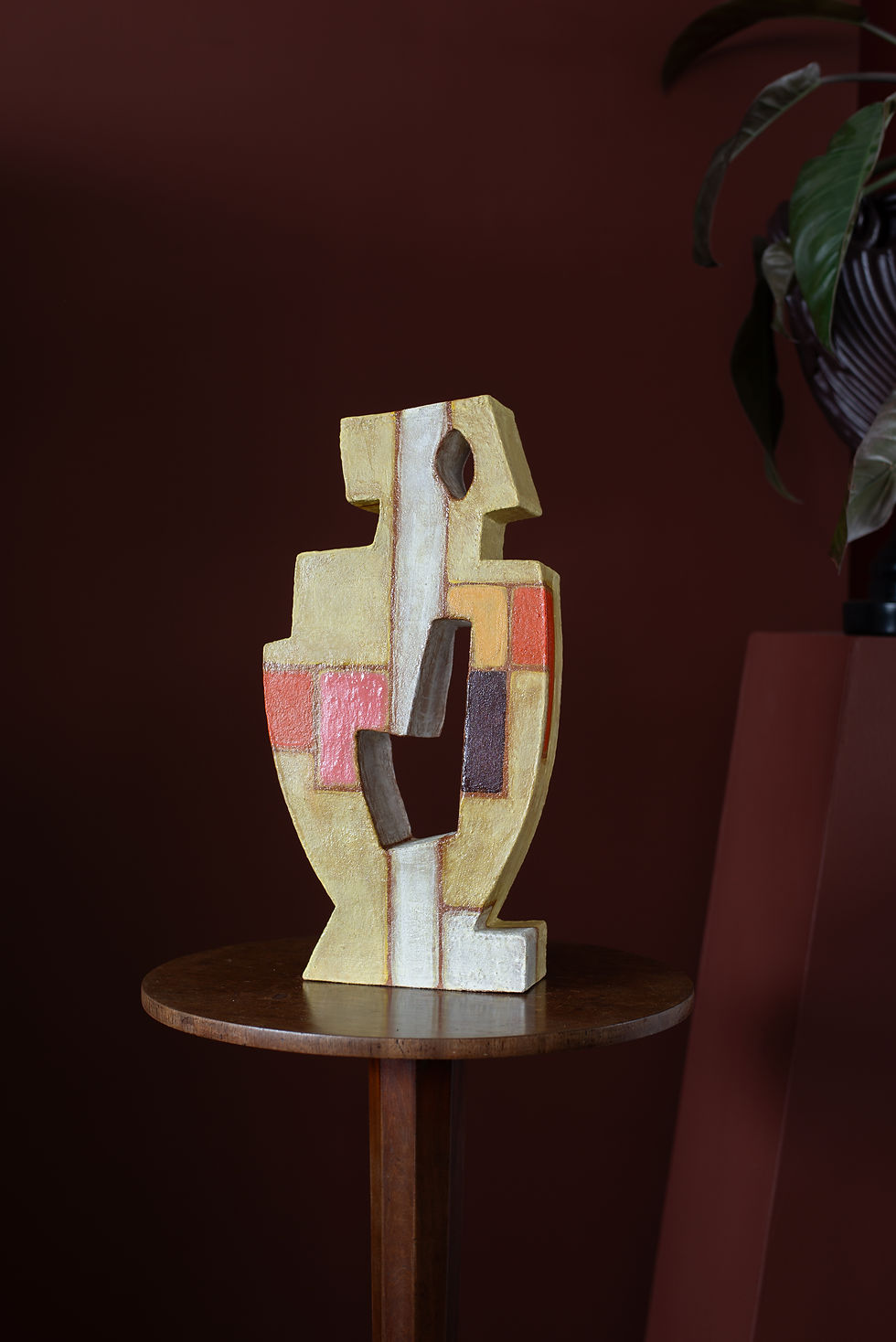 This sculptural piece is made using a hand-built slab construction, in under-glazed bisque fired earthenware.
