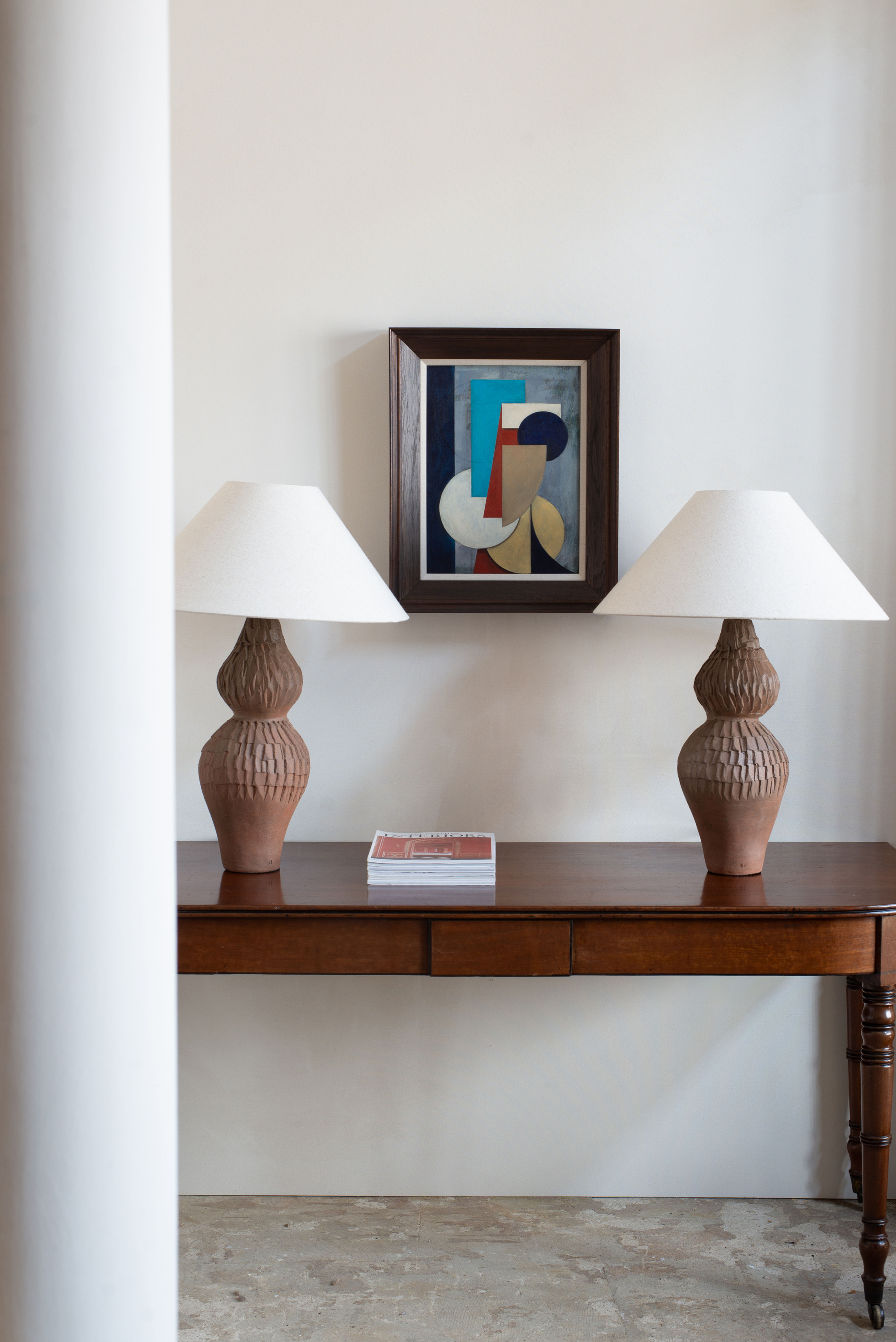 Hand - textured terracotta lamps by artist Linda Lencovic.