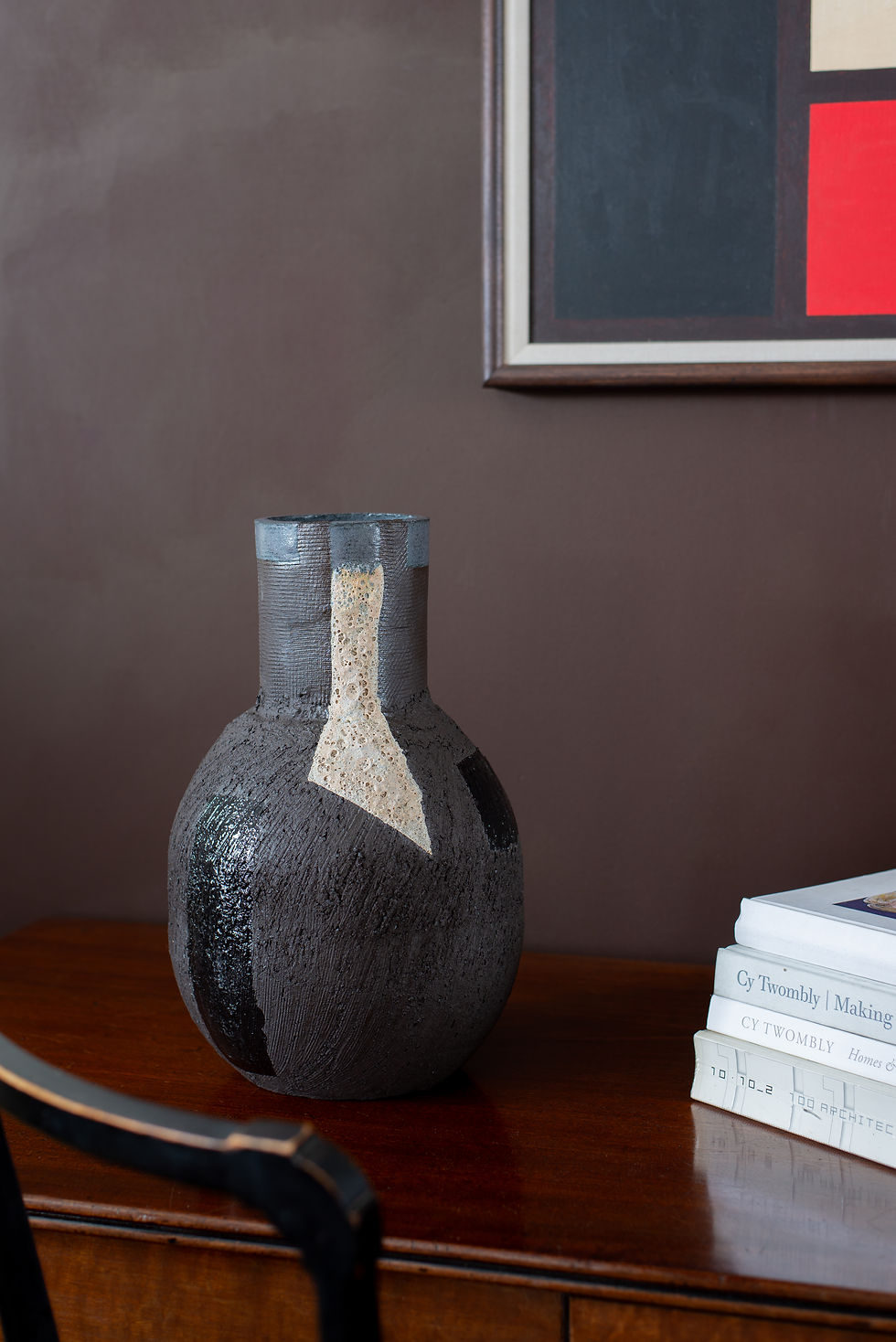 Black terracotta sculptural vessel with slip, glaze and volcanic glaze from St Leonard’s ceramicist Eddie Knevett.