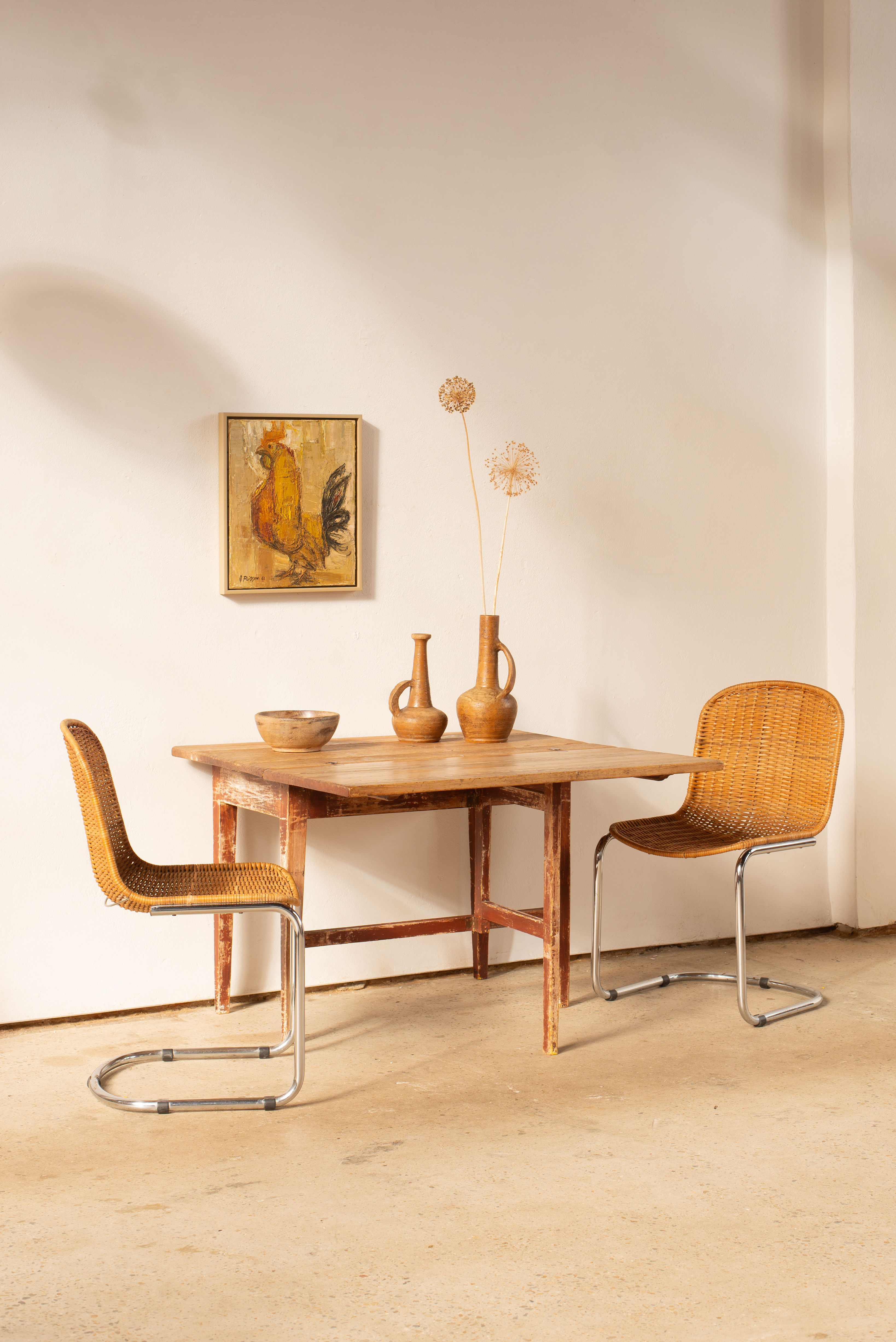A simplistic 19th Century Swedish Slagbord drop leaf table with a hinged top over a gated base.