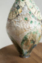 A stoneware sculptural vessel with glaze and stains by artist Linda Lencovic.