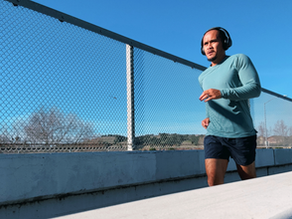Kelvin running across a bridge