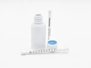 MedLock’s high-precision ClickDose syringes displayed with child-resistant bottles and caps, designed for safe and accurate dispensing of high-THC oils