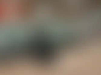 Black 30 mL plastic bottle with cap and oral dosing syringe displayed on a counter in a Canadian cannabis retail store setting