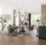 Contemporary open-plan dining space featuring green upholstered dining chairs, a rectangular dining table and modern pendant lighting.