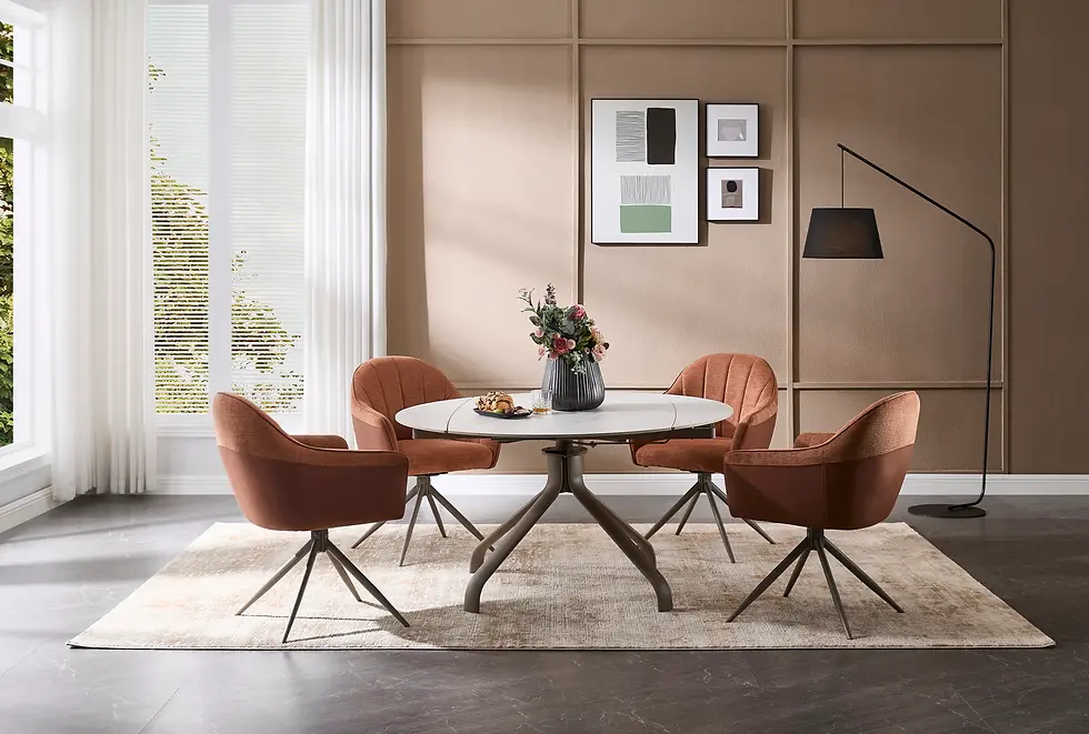 Warm-toned dining space featuring an oval dining table and four upholstered swivel dining chairs in a modern, soft-neutral interior setting.
