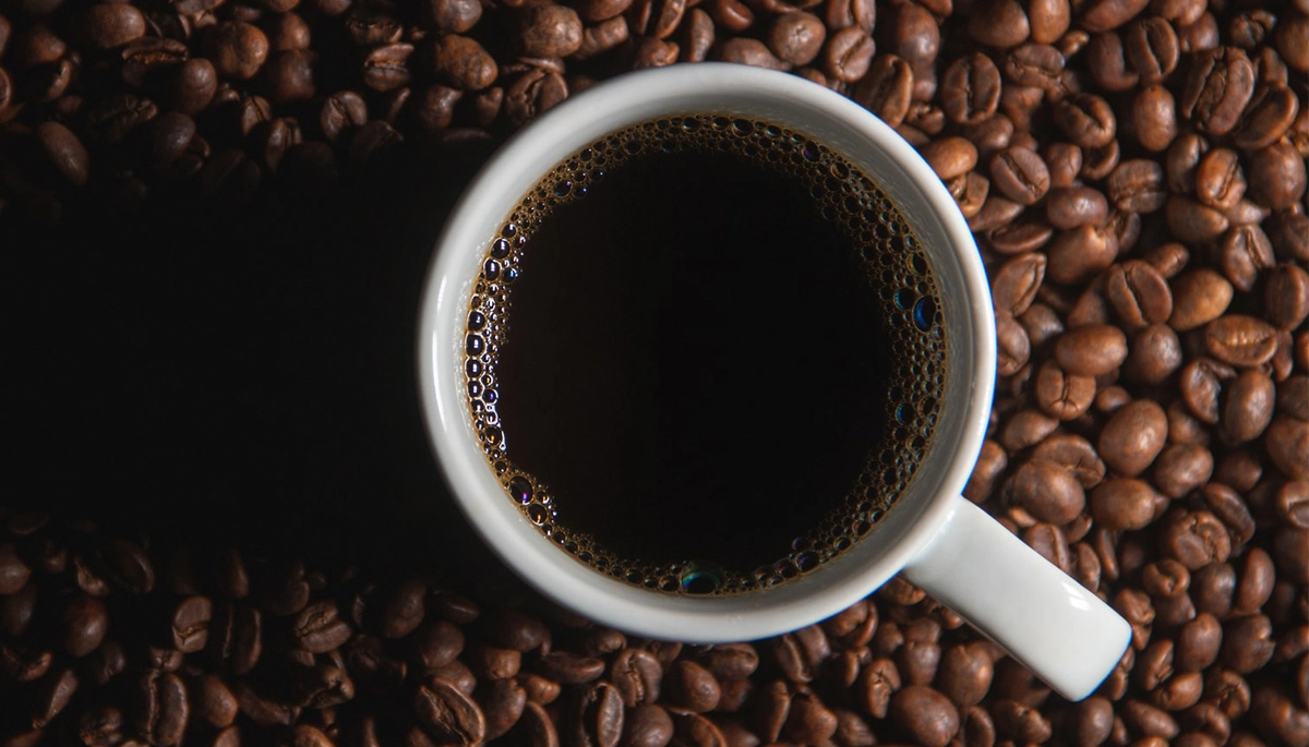 black-coffee-mug-beans.webp