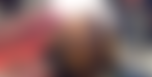 Intensive light shining through black sea glass, also known as pirate glass, revealing its true colour