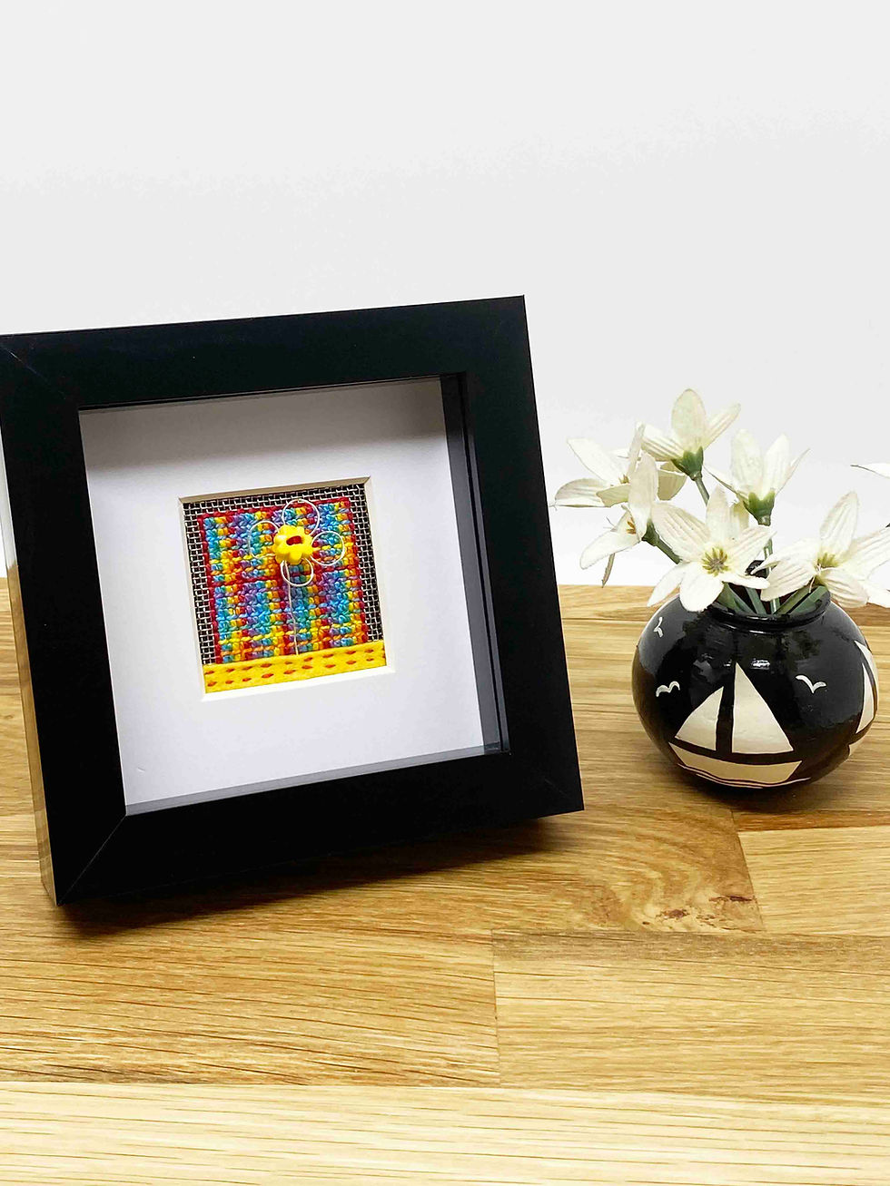 Thumbnail: Hand Embroidered Picture in Shadow Box Frame - Rainbow Daisy on Metal