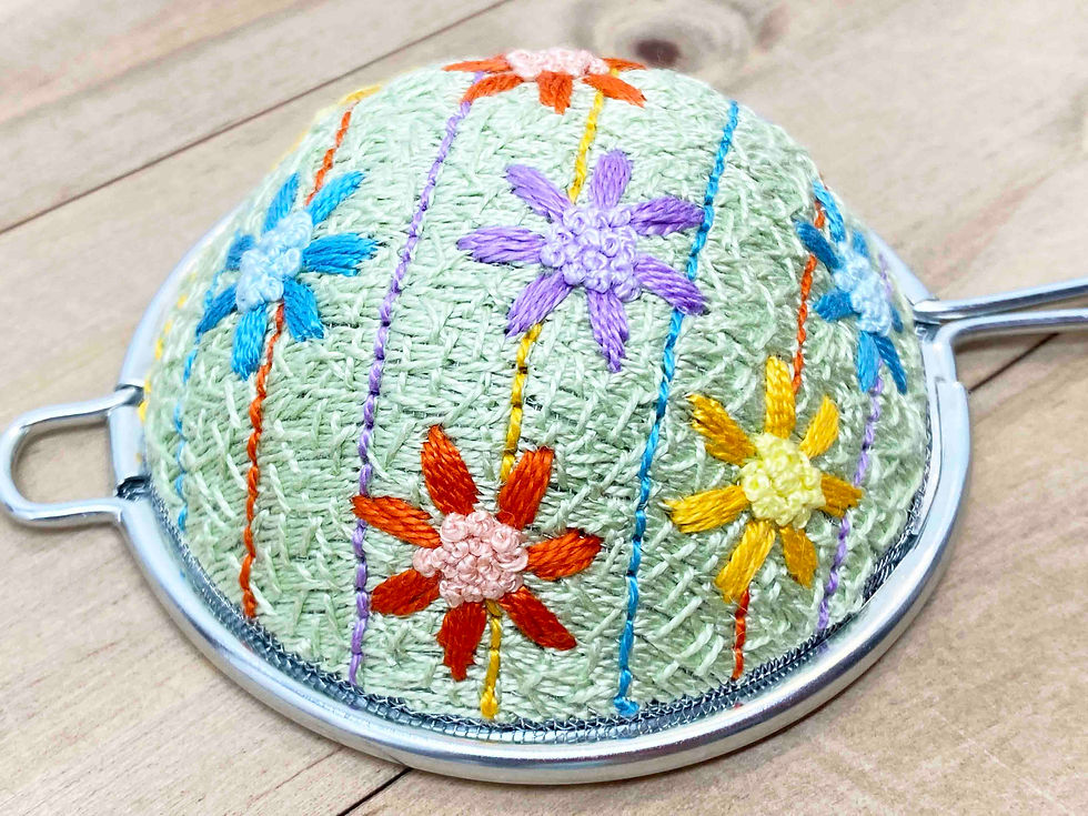 Thumbnail: Hand Embroidered Stainless Steel Tea Strainer - Spring Daisy (physical product)