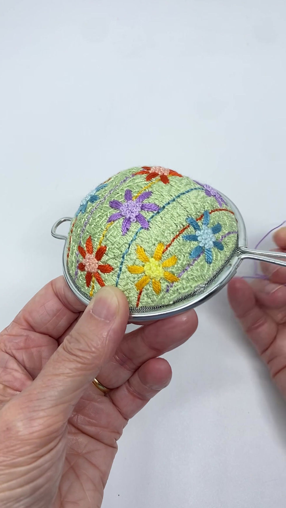 Thumbnail: Hand Embroidered Stainless Steel Tea Strainer - Spring Daisy (physical product)