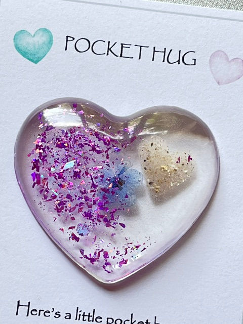 Thumbnail: Light purple pocket hug with a forget me not and an ashes heart