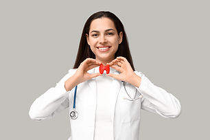 Portrait of female doctor with thyroid model on grey background.jpg
