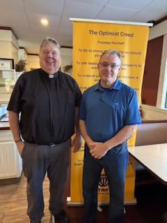Father Dave Flanagan and Optimist President Bob Hundhausen
