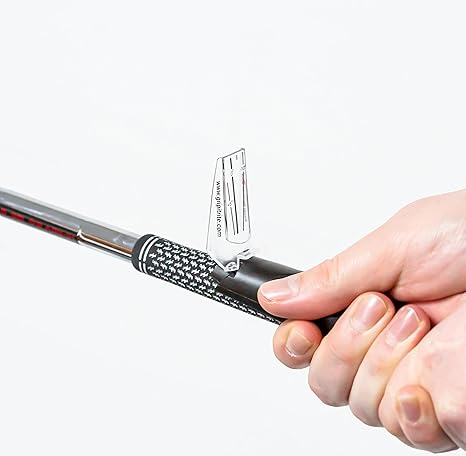 a hand holding the GripIt Rite Golf Grip Trainer
