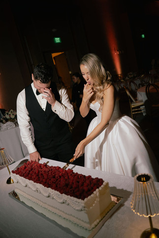 Couple cake cutting at Bride and father dancing at the wedding reception at San Juan Marriott Resort and Stelaris Casino ballroom