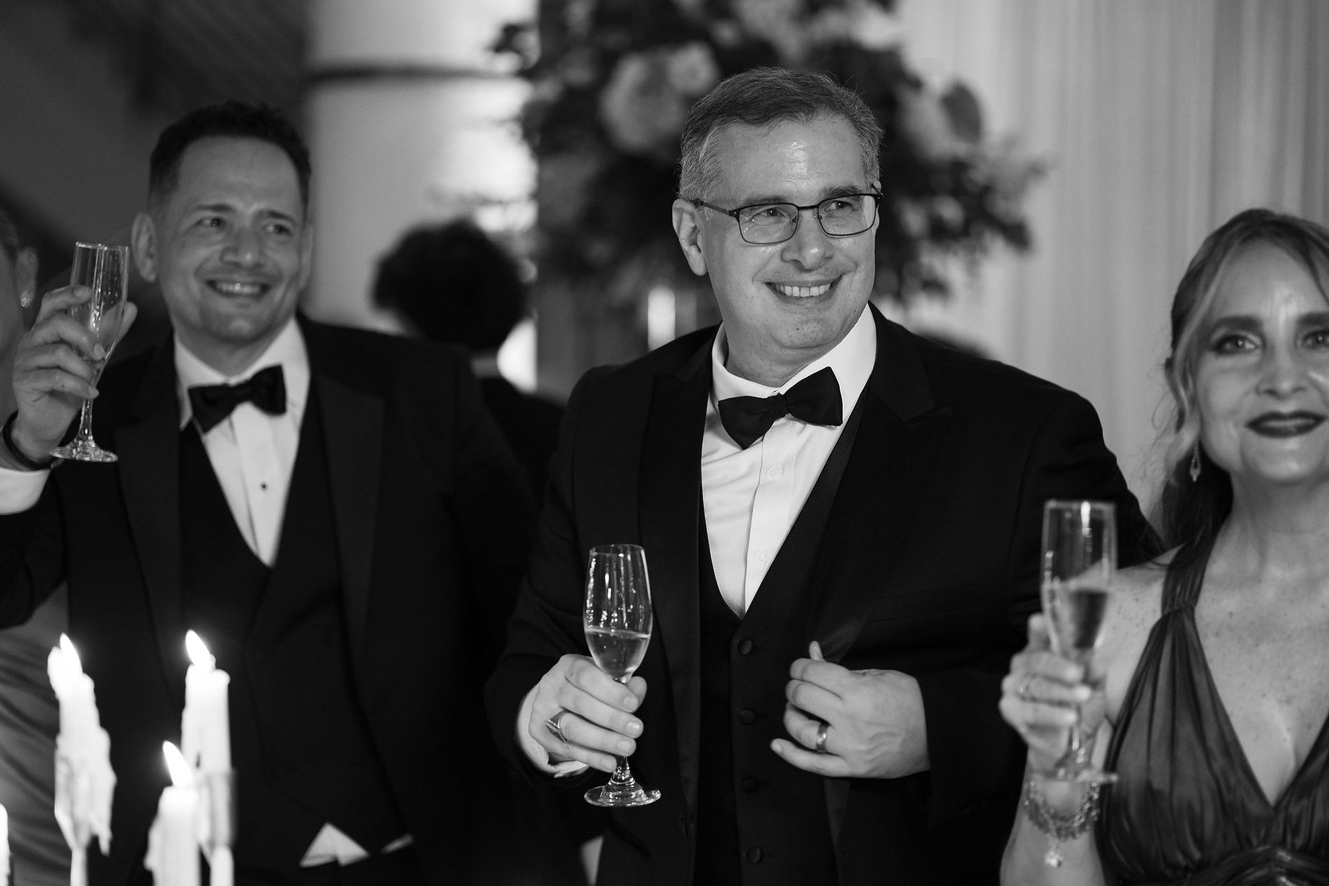 wedding guest holding a glass of  champagne 