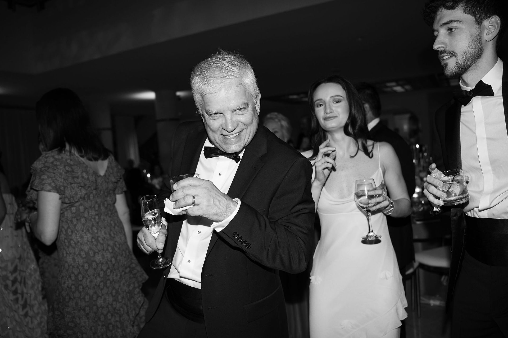 Wedding guests posing, black and white portrait 