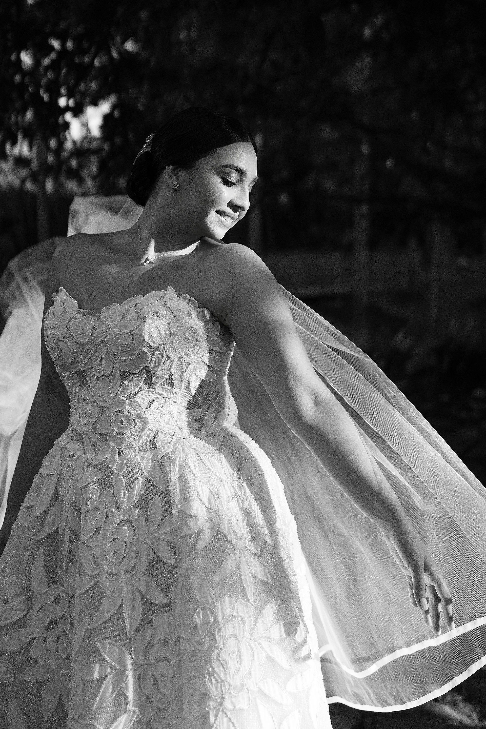 Black and white portrait of bride gently moving her vail at Museo de Arte de Puerto Rico