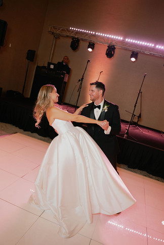 Bride and groom enjoying their first dance at Bride and father dancing at the wedding reception at San Juan Marriott Resort and Stelaris Casino ballroom