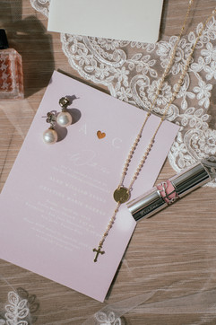 bridal lipstick and wedding invitations with soft pin pastels and lace at San Juan Mariott Resort