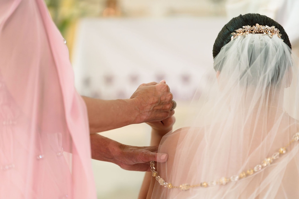 Bride and her mother holding hands at Puerto Rico church
