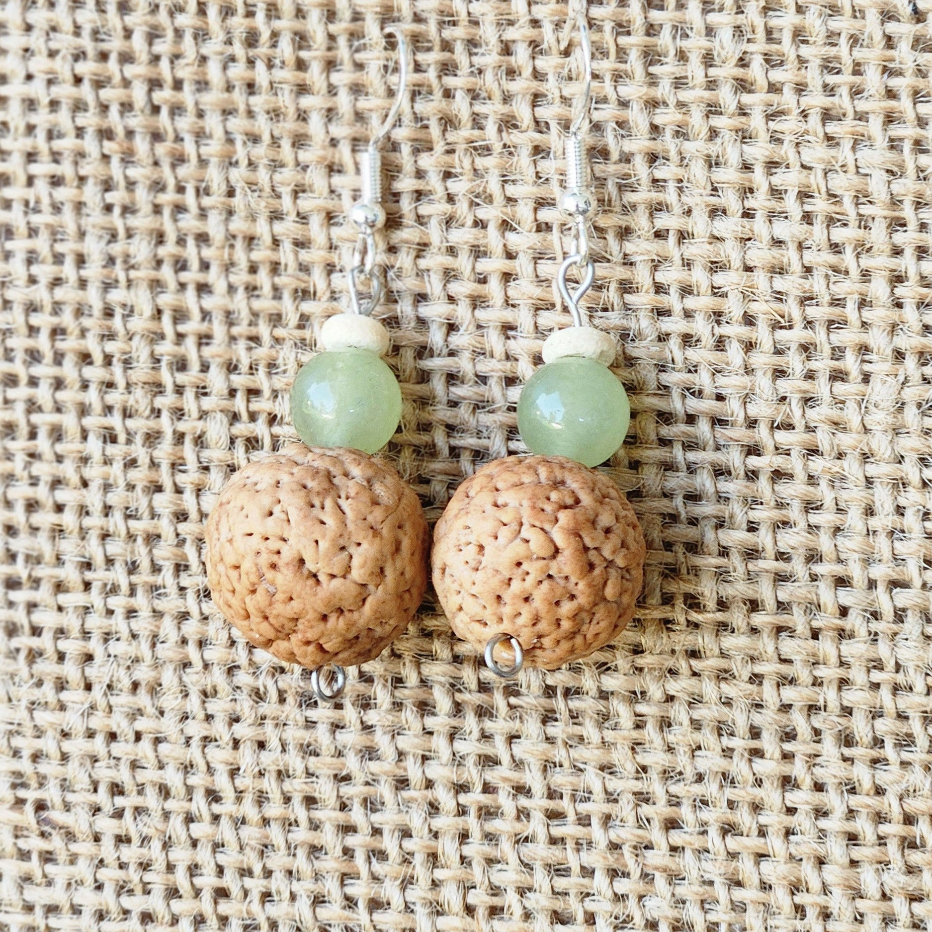 Earring made from Quandong ( Native Peach Seed). Adorned with gemstones