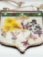 Pressed flower pendant with green border