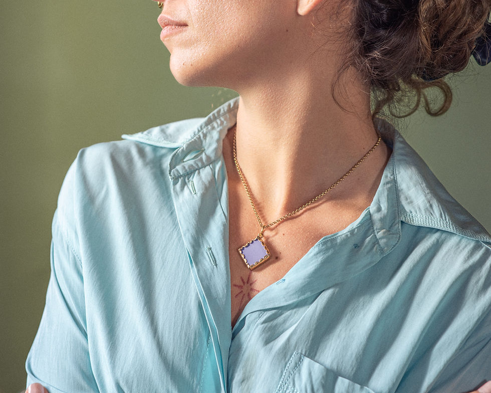 Woman wearing square pendant necklace