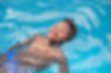 Little african child enjoying the summer in the pool .jpg