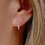 Thumbnail: 14K Diamond horseshoe huggie earring