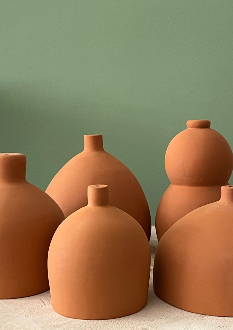 Minimal ceramic lighting in earthy tones for contemporary interior design.