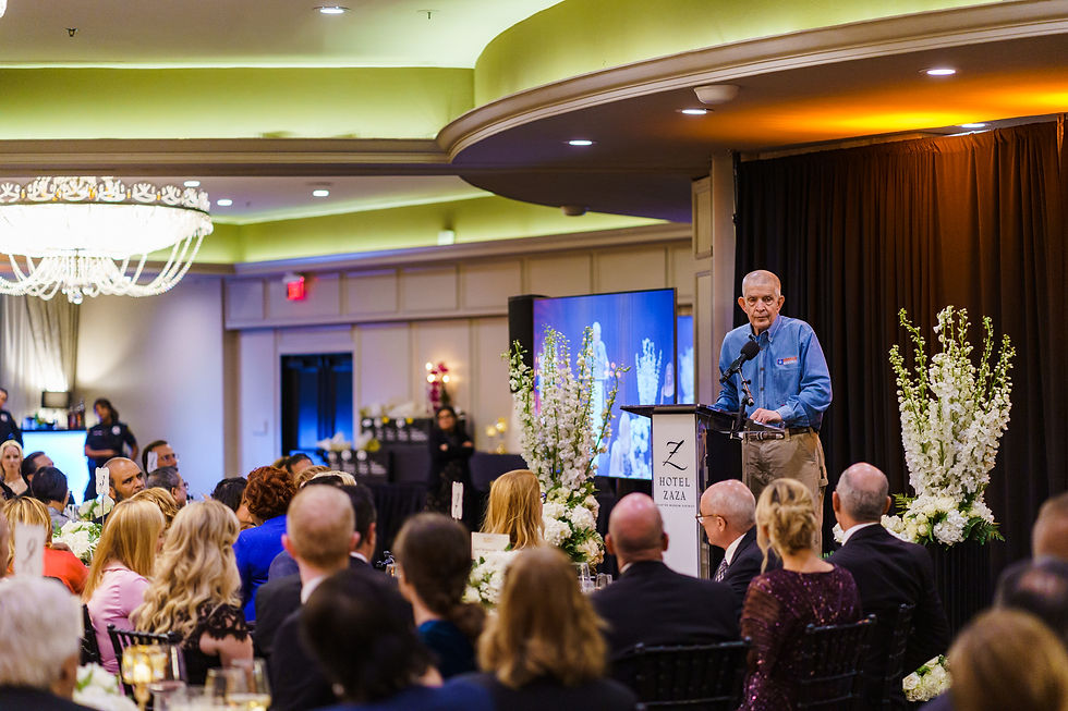 Jim McIngvale on stage by JH Photography