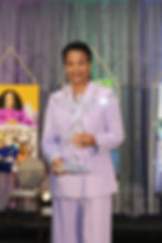 Spirit of Substance Honoree with the trademark award for this honor, an Art Glass Angel by