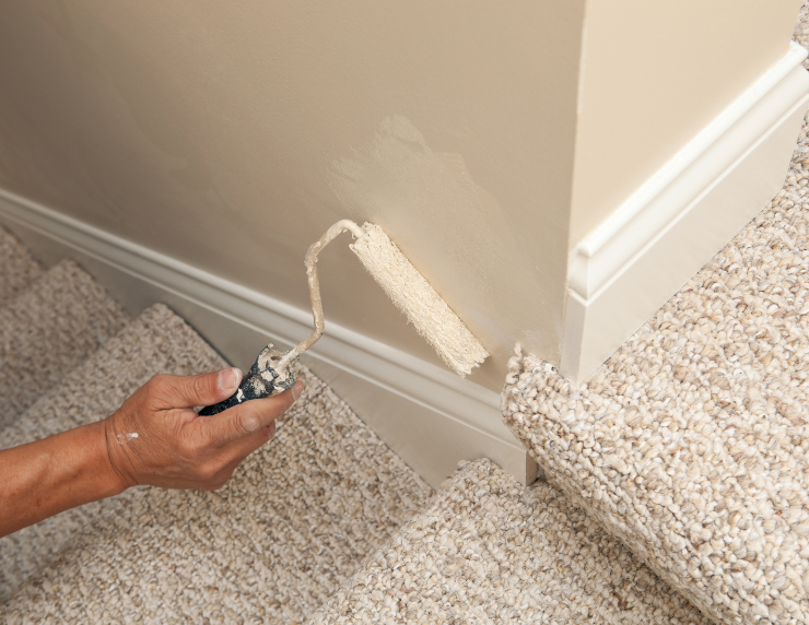 Paint touch-up with roller on staircase wall