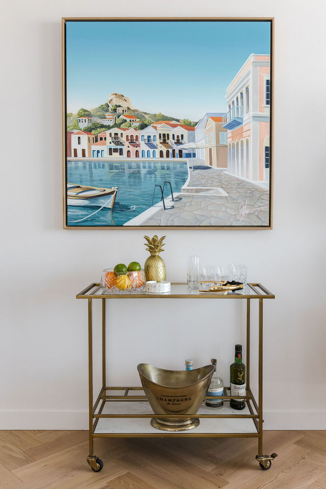 Coastal artwork and bar cart in dining room in New Farm, Brisbane home.
