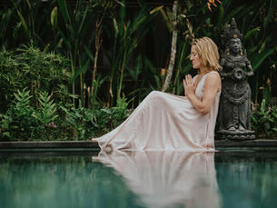 Woman meditating in bali