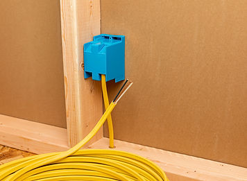 Copper electrical wiring in wall of house. 